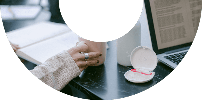 Girl at coworking space in little falls holding a cup of coffee while studying on a basalt desk